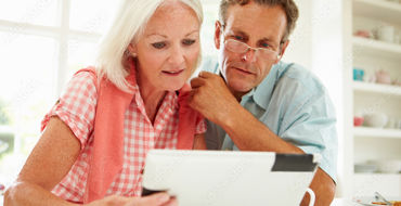 Couple Looking over their Digital Expression of Wishes on a Tablet device