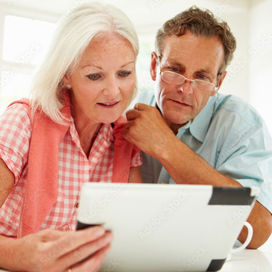 Couple Looking over their Digital Expression of Wishes on a Tablet device