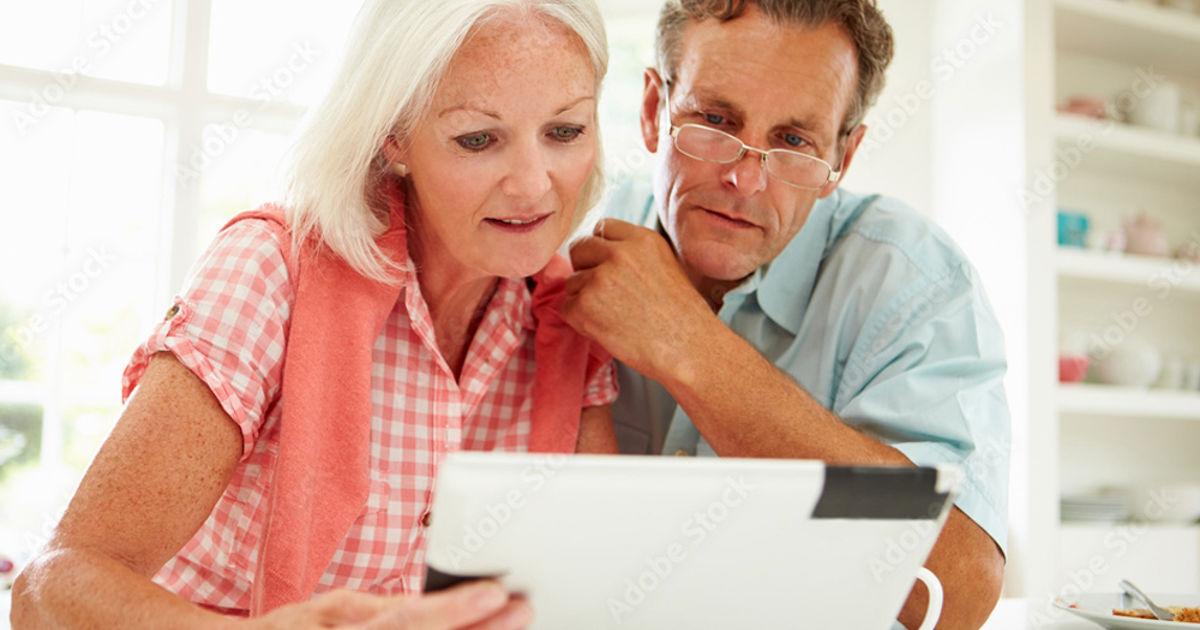 Couple Looking over their Digital Expression of Wishes on a Tablet device